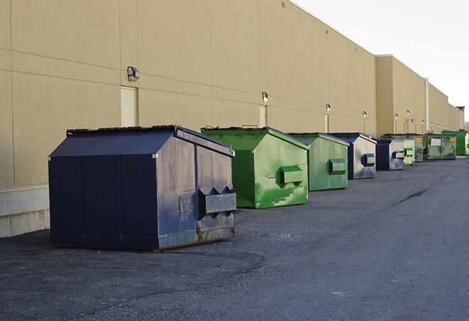 dumpsters lined up for use on busy construction site in Bogata